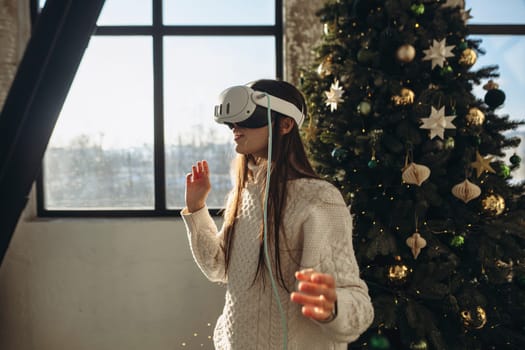 Amidst the sunshine of a winter morning, a lively young lady wears a VR headset. High quality photo