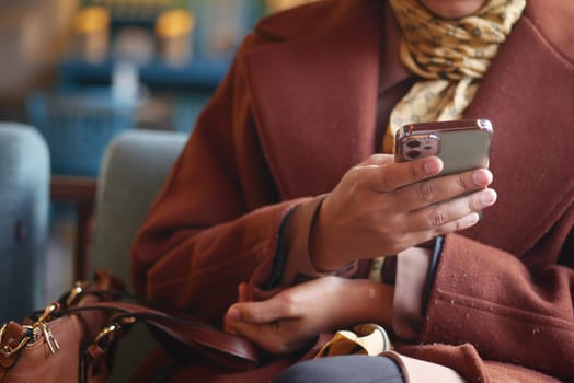 close up of women hand holding smart phone.