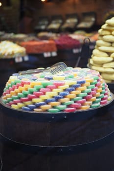 sugar coated jelly beans in the form of colored sliced fruit.