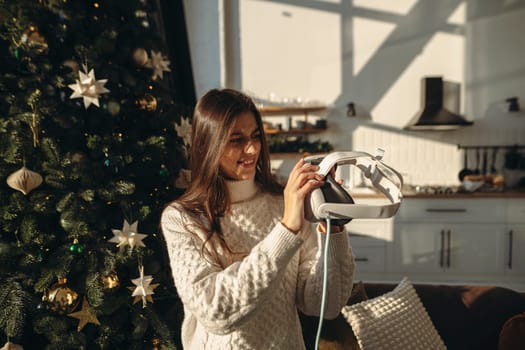 A Christmas present for an enthusiastic young lady was a virtual reality headset. High quality photo