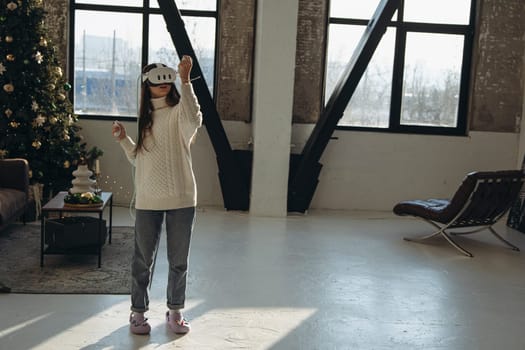 Surrounded by sunlight, an active young lady dons a VR headset. High quality photo