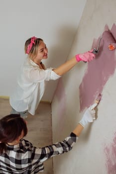 Sexy girl designer eats sushi on the construction site. painter has lunch after work. Concept interior design and room repair.