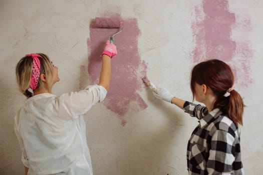 Sexy girl designer eats sushi on the construction site. painter has lunch after work. Concept interior design and room repair.