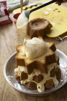 preparation of a homemade cream-filled dessert with as base a sponge cake