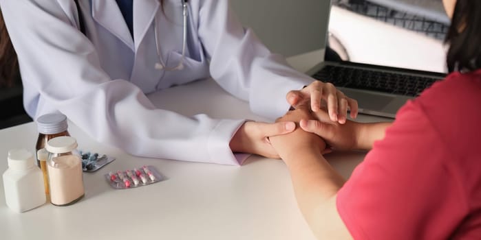 Doctors hold hands and give advice to patients. Give encouragement in treat disease.