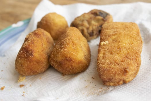 mixed fried food: potato croquettes, supplì, ricotta and aubergine meatballs mozzarella in carrozz