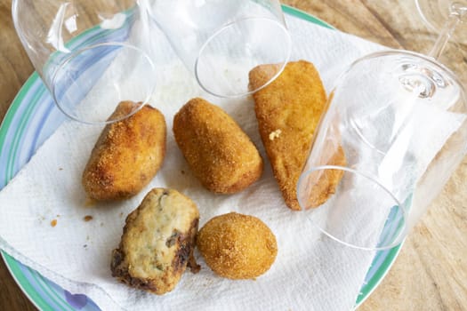 mixed fried food: potato croquettes, supplì, ricotta and aubergine meatballs mozzarella in carrozz