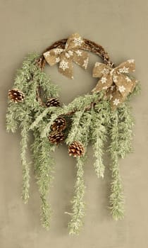New Year's decorative wreath on a beige wall. High quality photo