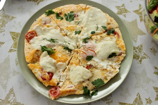 A round bowl with delicious scrambled eggs is on the table. High quality photo