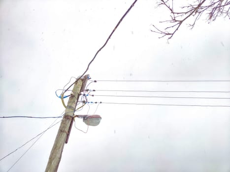 Old pole with wires against the sky. Electric transmission line, Eco-friendly energy