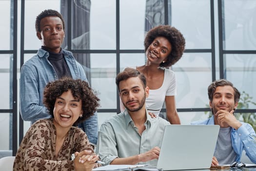 Employees working at computer together