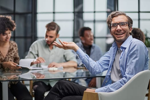 business man with executives working in background in office