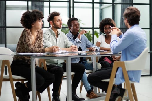 business man with executives working in background in office