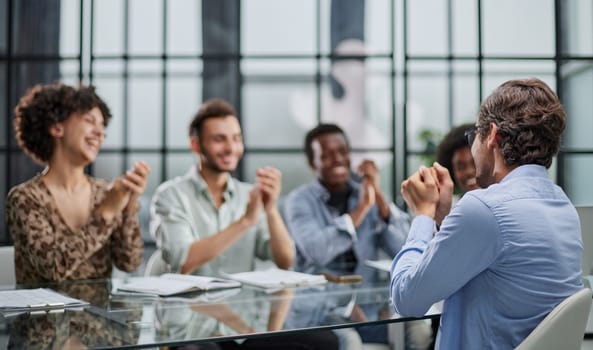 business man with executives working in background in office