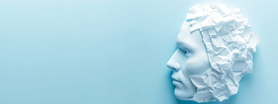 visual metaphor featuring a profile of a human head composed of crumpled paper texture against a blue background, human complexity, psychology, creativity, mind's potential for transformation change.