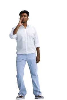 A man in a white shirt, on a white background, in full height, tells a secret.
