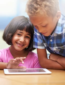 Happy children, tablet and classroom for elearning, education or online lesson together at school. Young boy, girl or elementary kids smile on technology for games, entertainment or virtual class.