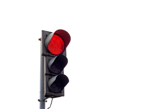 Red traffic light close up, isolated on white background