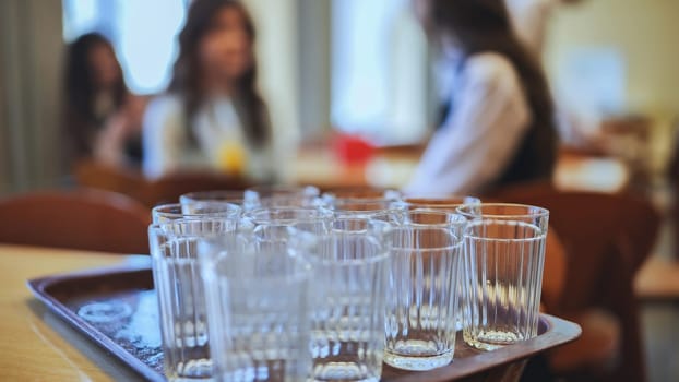 Glass tumblers in the school cafeteria