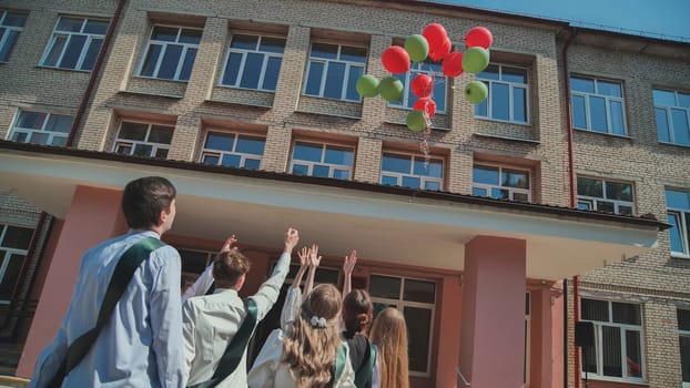 Berezovka, Belarus - May 31, 2023 High school graduates launch balloons into the sky