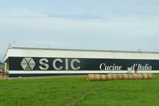 Parma, Italy - June 14, 2023: Facade of an industrial building for a furniture manufacturing company - SCIC.