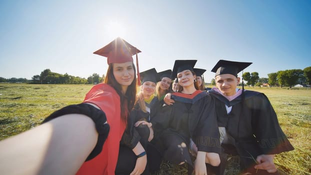 College alumni take selfies in the meadow