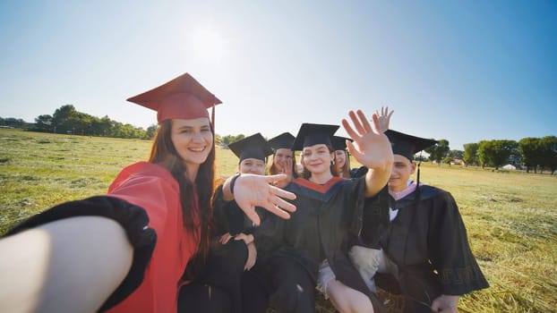 College alumni take selfies in the meadow