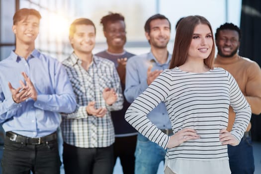 Successful business team smiling while standing in the office