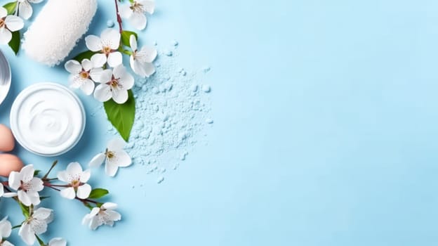 Gorgeous spring cherry branches adorned with delicate white flowers set against a soft light blue background. Petals gently falling, welcoming the beauty of spring. Ample copy space.