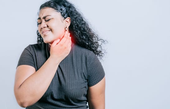 Young woman suffering with neck pain. Neck pain and stress concept. People with neck tension, Girl with neck pain isolated