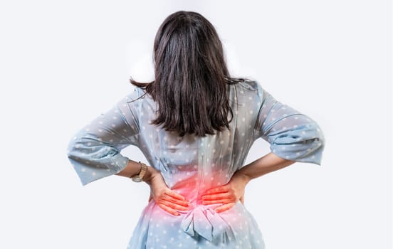 Girl with spine problems isolated. Woman with back pain on isolated background. lumbar problems concept. A sore girl with back pain
