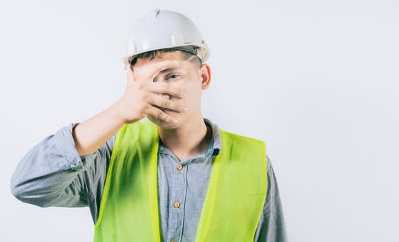 Man engineer with irritated eyes isolated. Young engineer with conjunctivitis on isolated background 