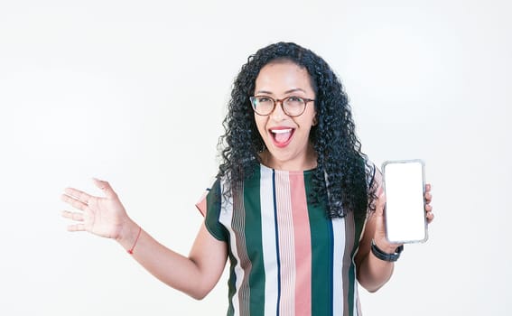 Smiling afro girl showing cell phone screen isolated. Happy young afro woman showing an advertisement on cell phone screen