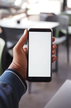 Close up of young man hand using smart phone