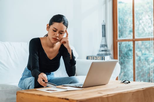 Stressed young woman has financial problems with credit card debt to pay uttermost show concept of bad personal money and mortgage pay management crisis.