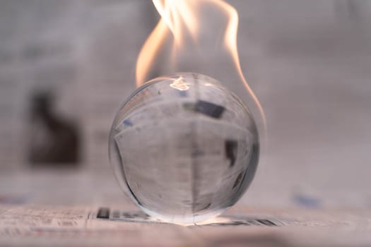 Glass globe on fire. Planet Earth Burning. Global Warming and Climate Change Concept.