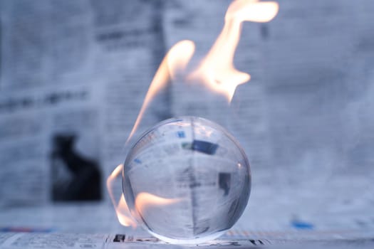 Glass globe on fire. Planet Earth Burning. Global Warming and Climate Change Concept.
