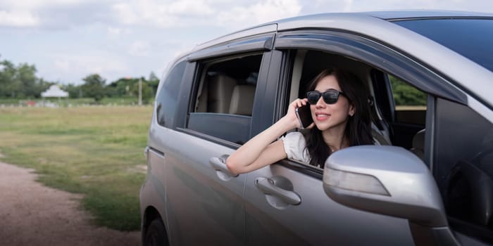 Young Asian woman enjoy and fun outdoors lifestyle road trip in forest on summer travel vacation.