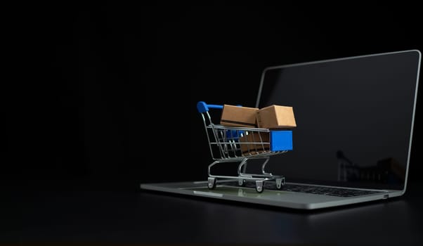 Boxes in a shopping car on a laptop keyboard. Ideas about online shopping, online shopping is a form of electronic commerce that allows consumers to directly buy goods from seller over the internet.