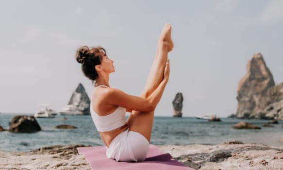 Fitness woman sea. Outdoor workout on yoga mat in park near to ocean beach. Female fitness pilates yoga routine concept. Healthy lifestyle. Happy fit woman exercising with rubber band in park.