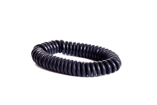 Black elastic band for hair spring, isolated on a white background