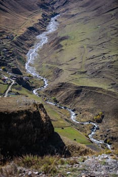 Panoramic view of the winding mountain river from above, the beauty and power of nature.