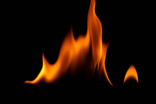 Hot flames on a black background. Beautiful flame of fire in the dark. Abstract of burning flames and smoke.