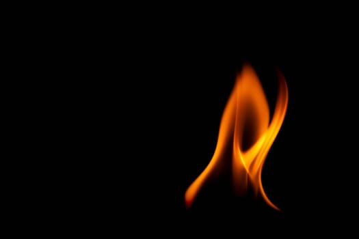 Hot flames on a black background. Beautiful flame of fire in the dark. Abstract of burning flames and smoke.