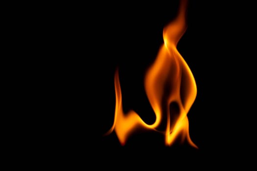 Hot flames on a black background. Beautiful flame of fire in the dark. Abstract of burning flames and smoke.