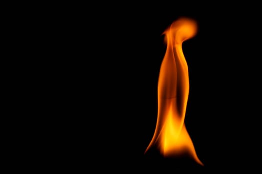 Hot flames on a black background. Beautiful flame of fire in the dark. Abstract of burning flames and smoke.