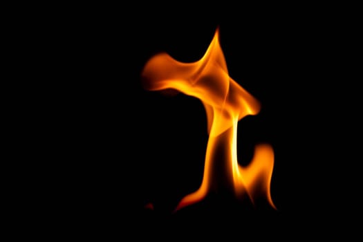 Hot flames on a black background. Beautiful flame of fire in the dark. Abstract of burning flames and smoke.