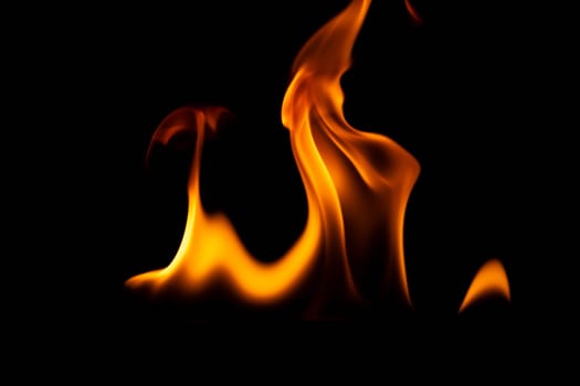 Hot flames on a black background. Beautiful flame of fire in the dark. Abstract of burning flames and smoke.