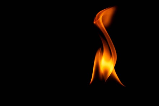 Hot flames on a black background. Beautiful flame of fire in the dark. Abstract of burning flames and smoke.