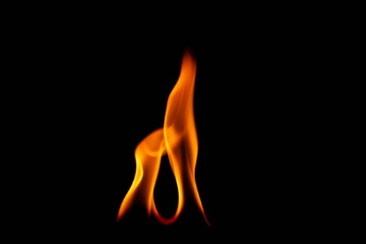 Hot flames on a black background. Beautiful flame of fire in the dark. Abstract of burning flames and smoke.